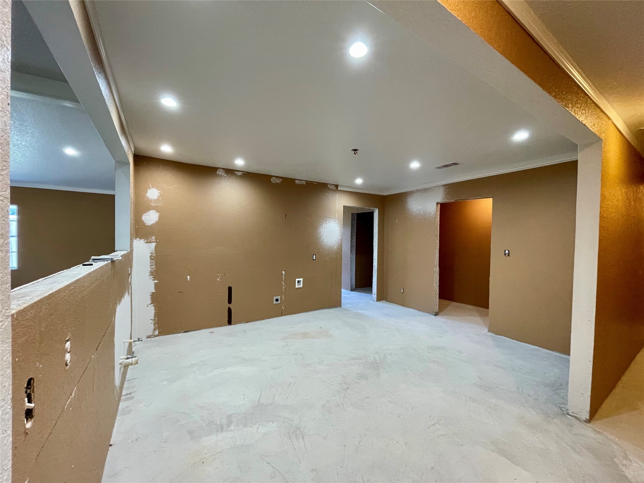 903 West 8th Street Freeport, TX 77541 - Photo 8 of 20 an empty room with wooden floor and windows