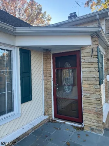 a view of a wooden door of the house