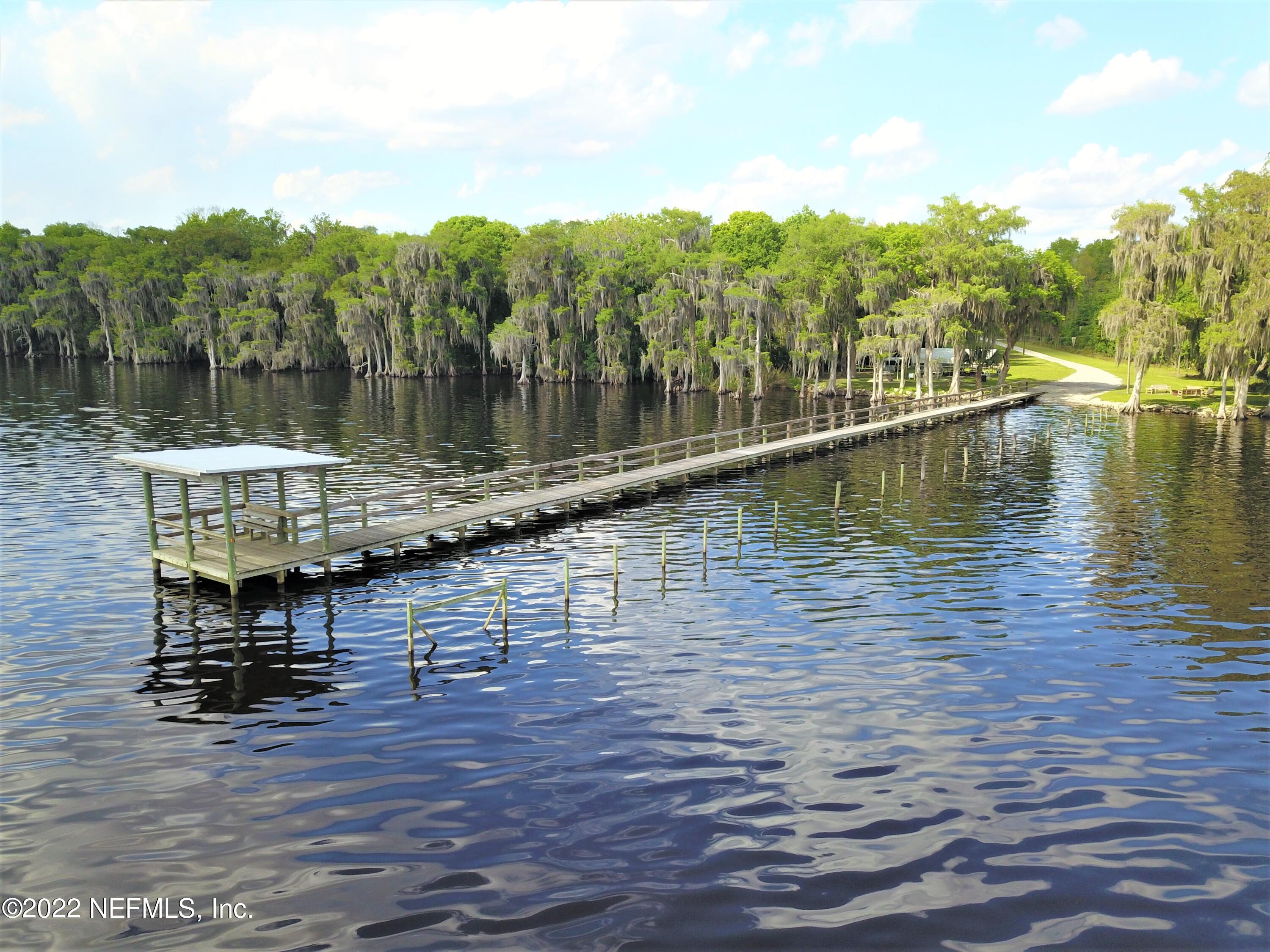 113 3rd Street Georgetown, FL 32139 - Photo 5 of 13 a view of a lake with a mountain