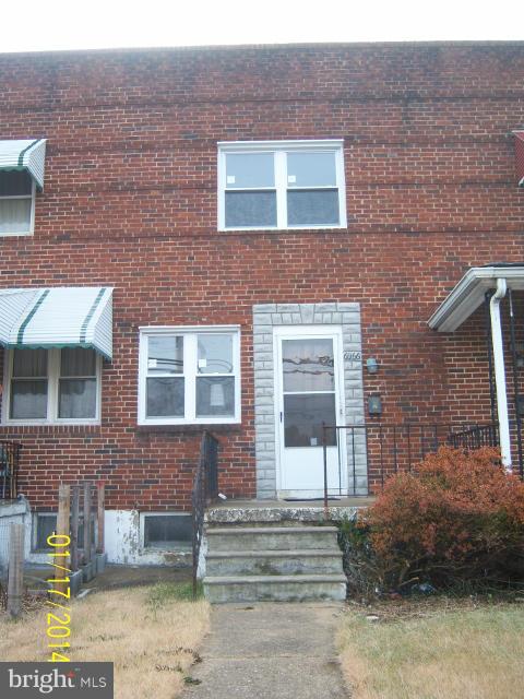 6966 Reisterstown Road Baltimore, MD 21215 - Photo 1 of 17 a front view of a brick house with a yard