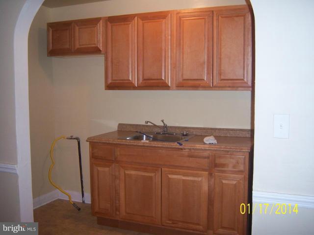 6966 Reisterstown Road Baltimore, MD 21215 - Photo 12 of 17 a utility room with dryer and washer
