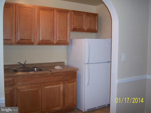 6966 Reisterstown Road Baltimore, MD 21215 - Photo 13 of 17 a room with storage and utility