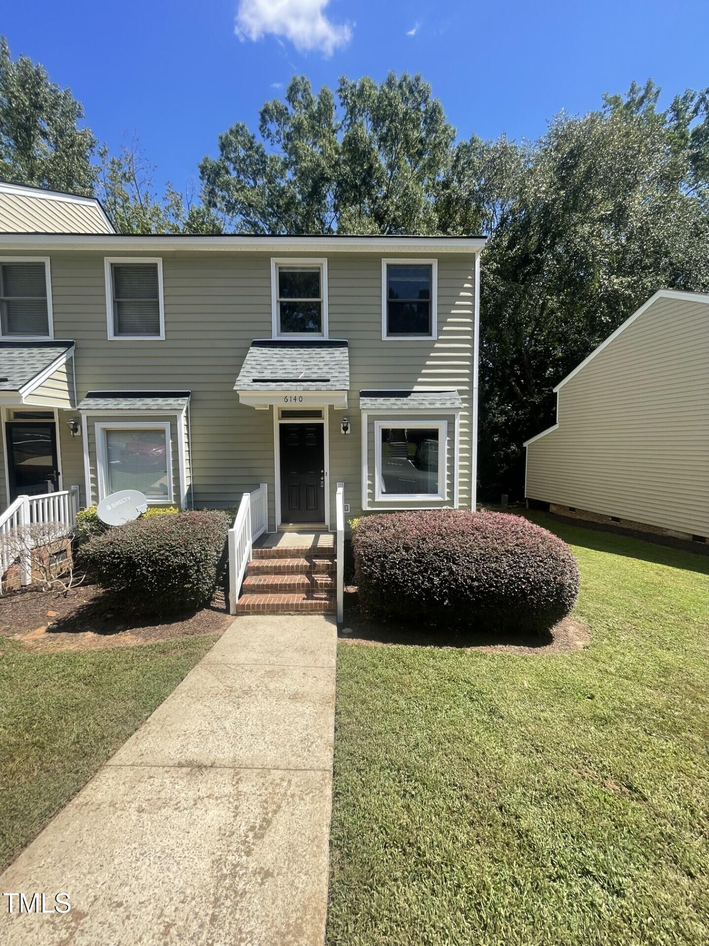 6140 Loch Laural Lane Raleigh, NC 27613 - Photo 1 of 21 a view of a house with a yard