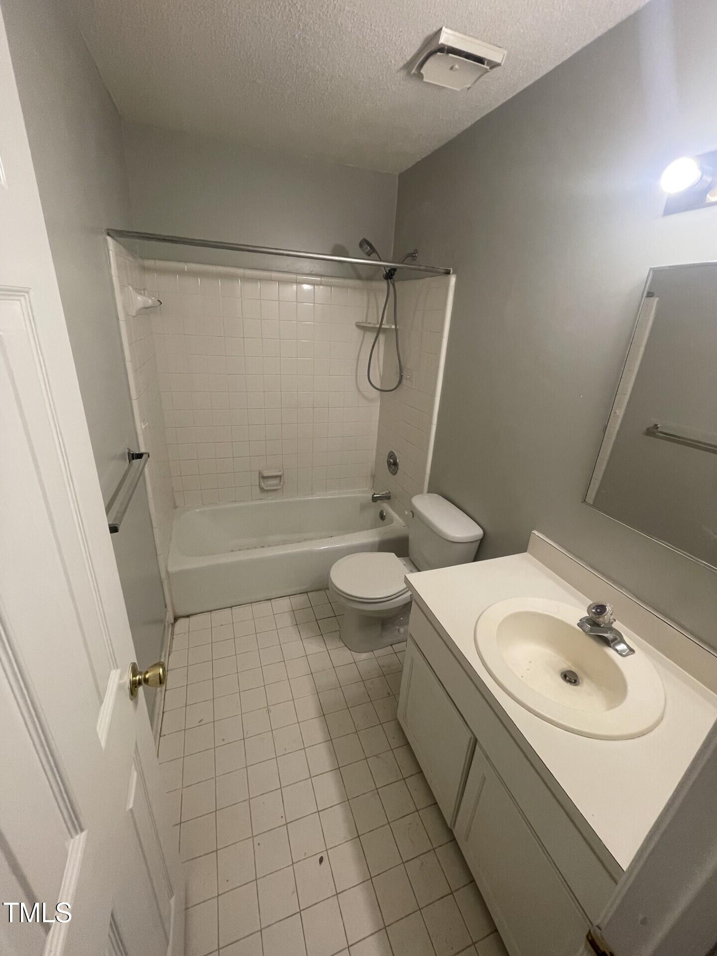 6140 Loch Laural Lane Raleigh, NC 27613 - Photo 18 of 21 a bathroom with a sink a toilet and shower
