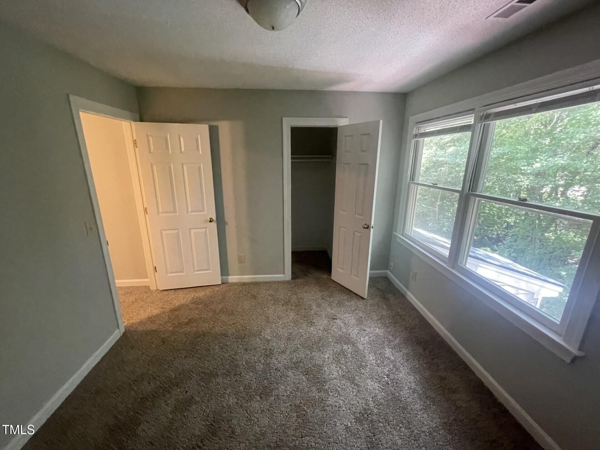 6140 Loch Laural Lane Raleigh, NC 27613 - Photo 20 of 21 an empty room with windows