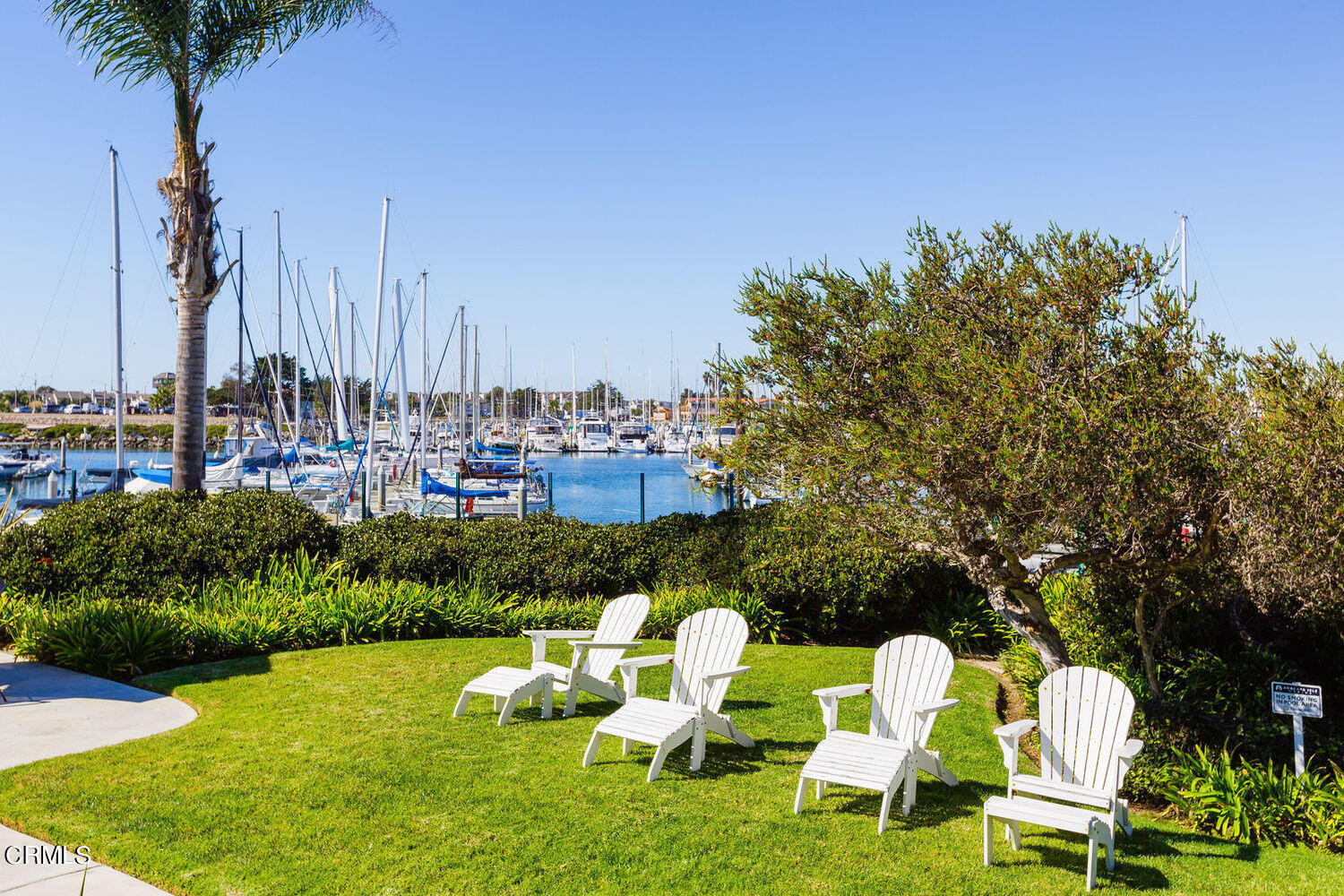 2901 Peninsula Road, Unit 248 Oxnard, CA 93035 - Photo 24 of 26 a backyard of a house with table and chairs