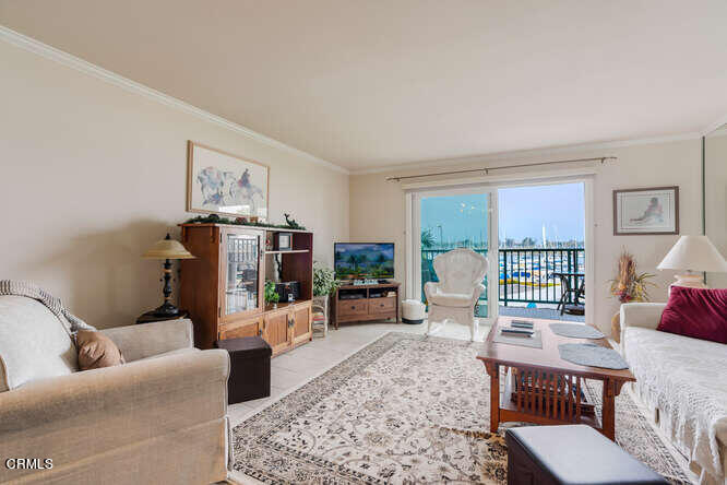2901 Peninsula Road, Unit 248 Oxnard, CA 93035 - Photo 8 of 26 a living room with furniture and a flat screen tv