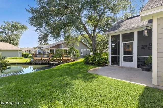 a swimming pool with outdoor seating and yard