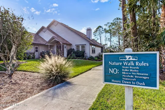 a sign that is on a brick wall