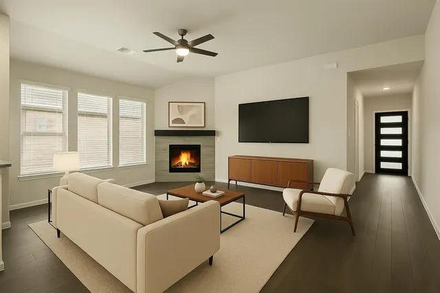 a living room with furniture and a flat screen tv
