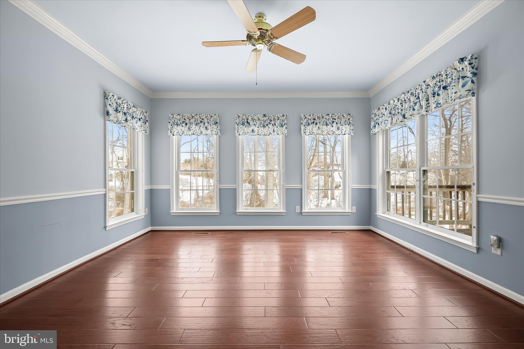 6428 Hickory Overlook, Unit 71 Columbia, MD 21044 - Photo 13 of 63 a view of an empty room with wooden floor and a window
