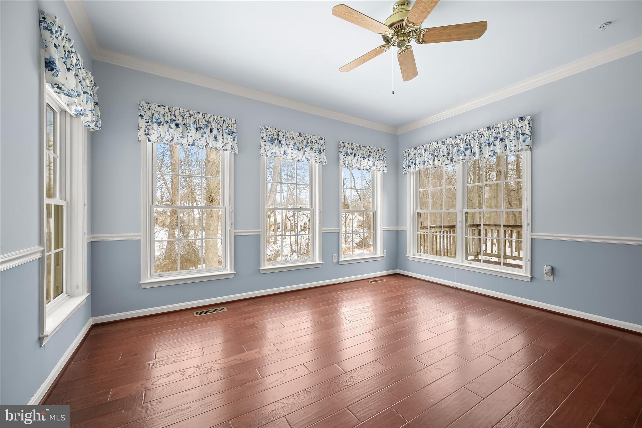6428 Hickory Overlook, Unit 71 Columbia, MD 21044 - Photo 14 of 63 a view of an empty room with wooden floor and a window