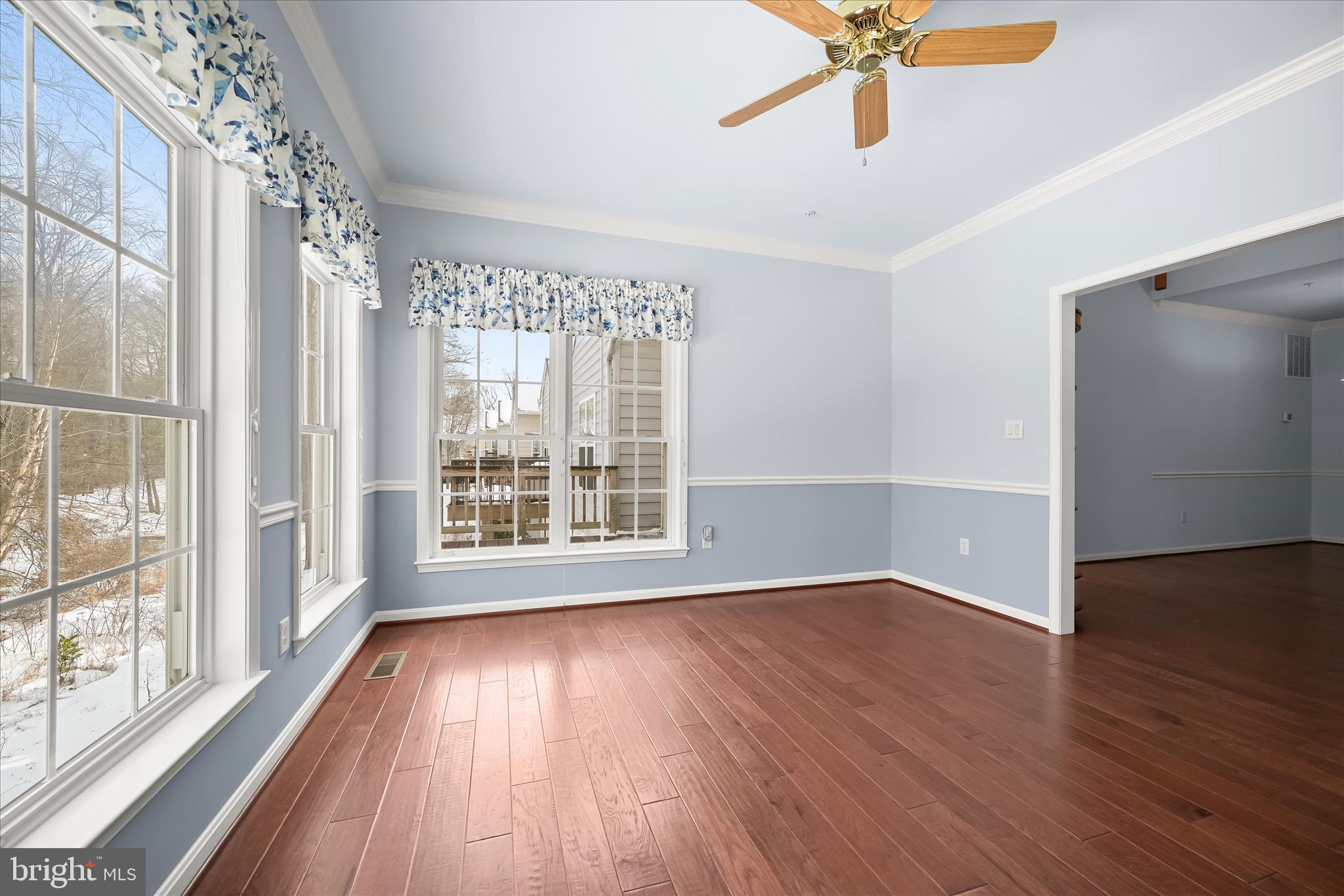6428 Hickory Overlook, Unit 71 Columbia, MD 21044 - Photo 15 of 63 a view of an empty room with wooden floor and a window