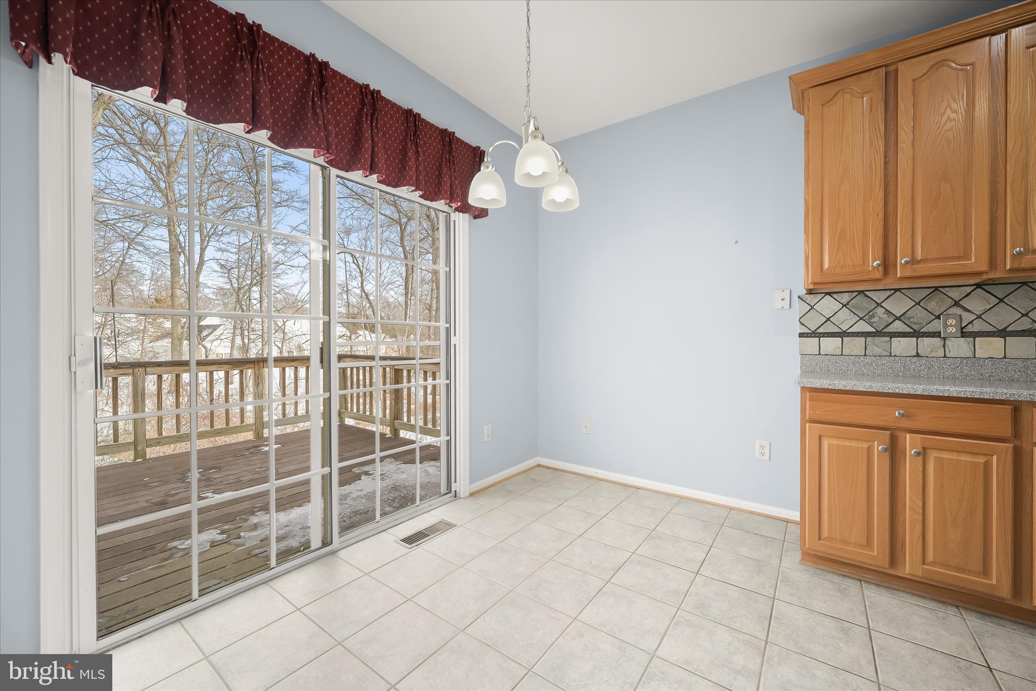 6428 Hickory Overlook, Unit 71 Columbia, MD 21044 - Photo 17 of 63 a view of a kitchen with wooden floor and windows