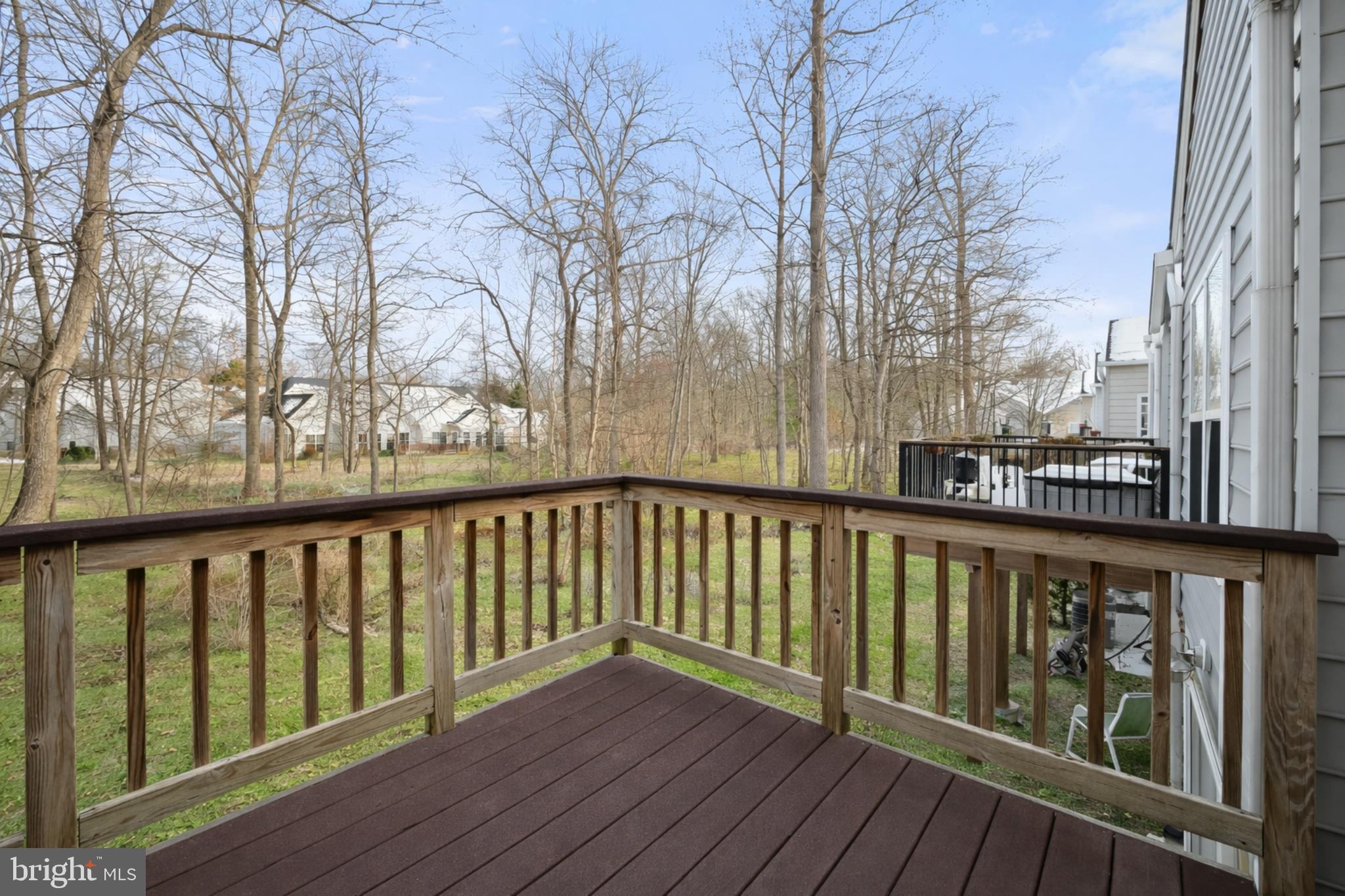 6428 Hickory Overlook, Unit 71 Columbia, MD 21044 - Photo 21 of 63 a view of roof deck with wooden floor and fence