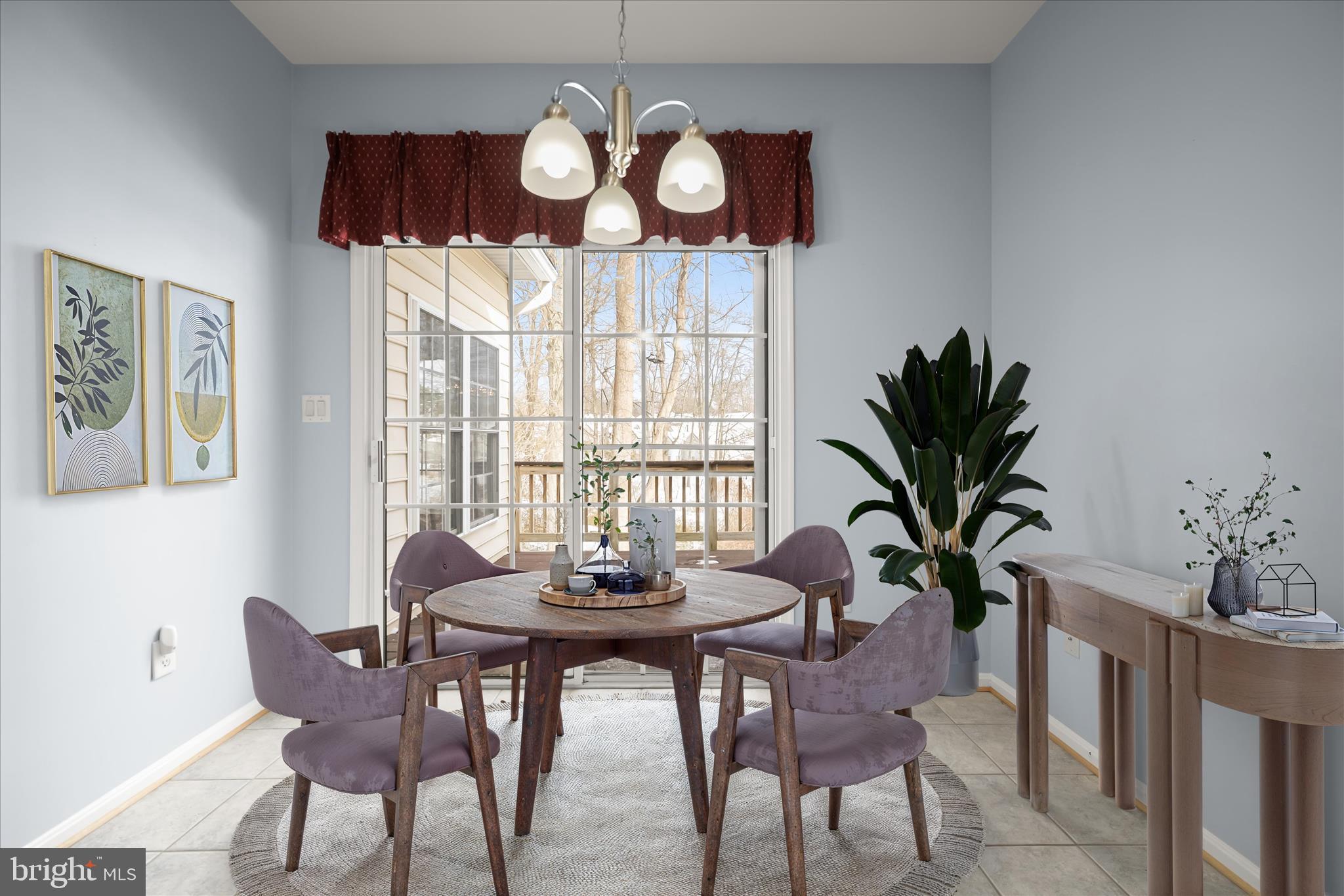 6428 Hickory Overlook, Unit 71 Columbia, MD 21044 - Photo 22 of 63 a view of a dining room with furniture a chandelier and wooden floor