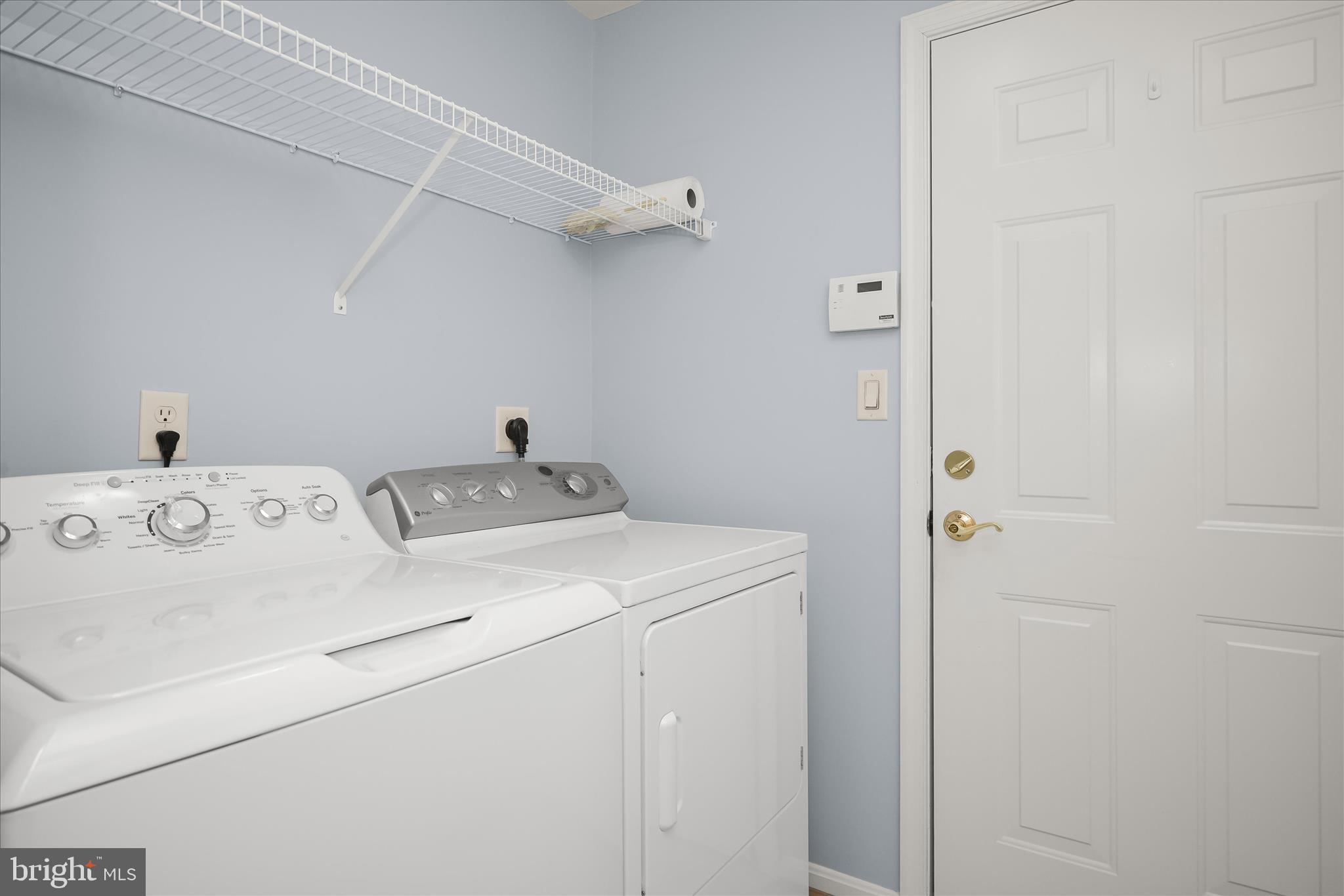 6428 Hickory Overlook, Unit 71 Columbia, MD 21044 - Photo 29 of 63 a utility room with dryer and washer