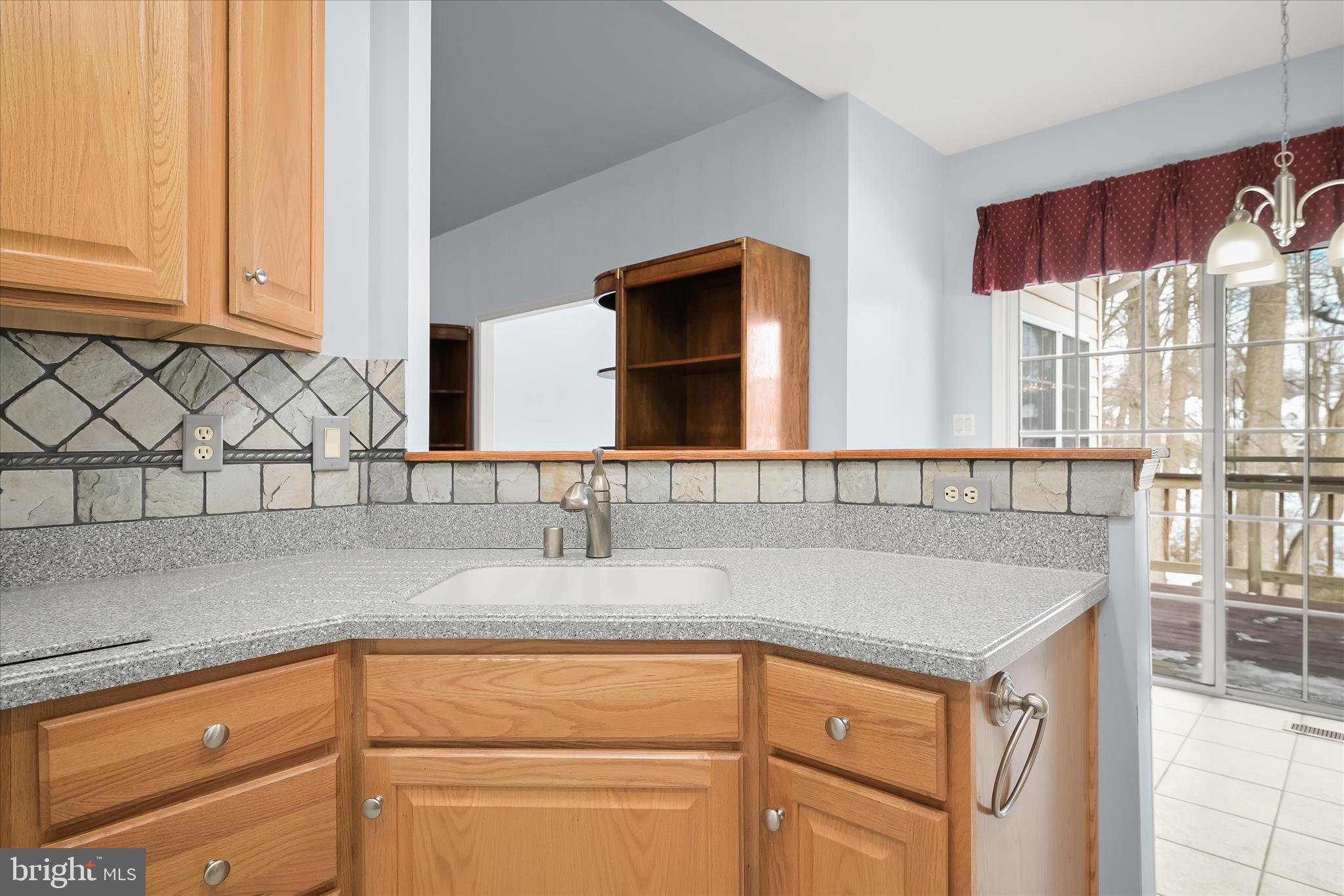 6428 Hickory Overlook, Unit 71 Columbia, MD 21044 - Photo 32 of 63 a kitchen with stainless steel appliances granite countertop a sink and a cabinets