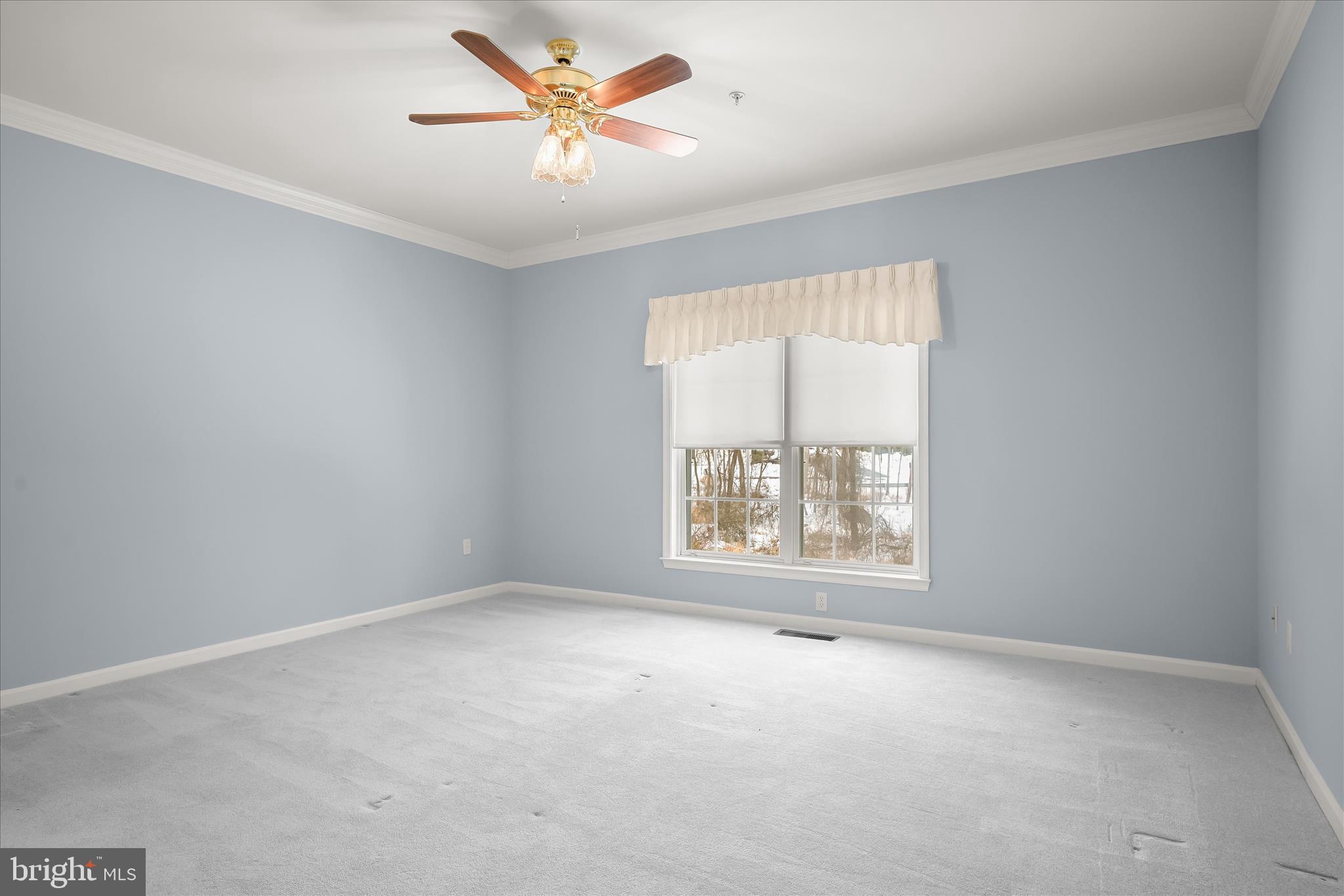 6428 Hickory Overlook, Unit 71 Columbia, MD 21044 - Photo 34 of 63 an empty room with a window and a fan