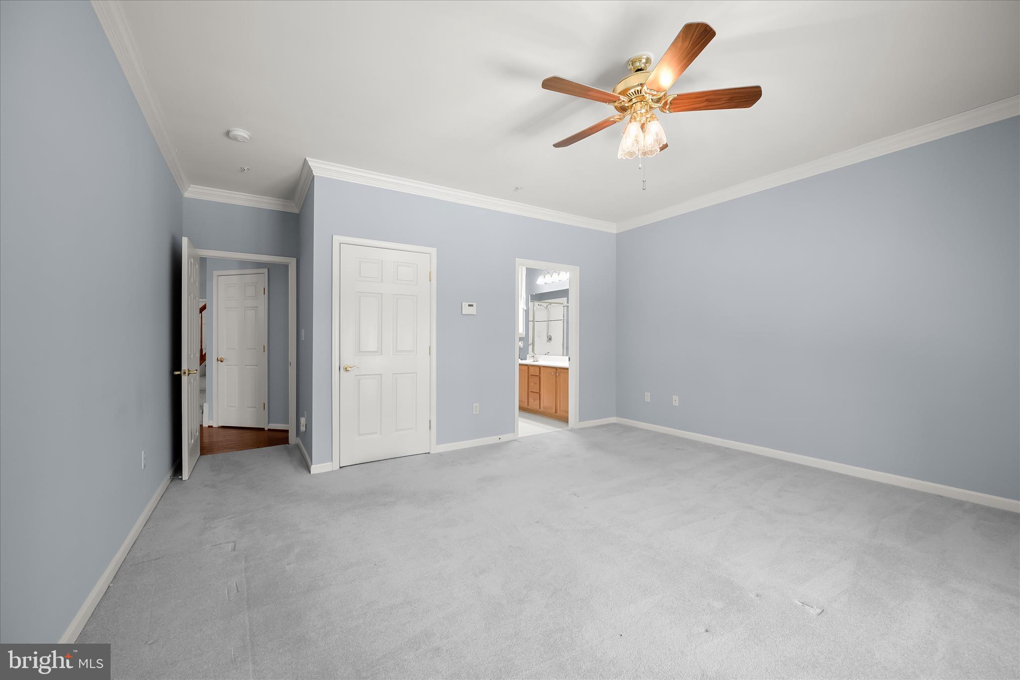 6428 Hickory Overlook, Unit 71 Columbia, MD 21044 - Photo 35 of 63 an empty room with closet and fan