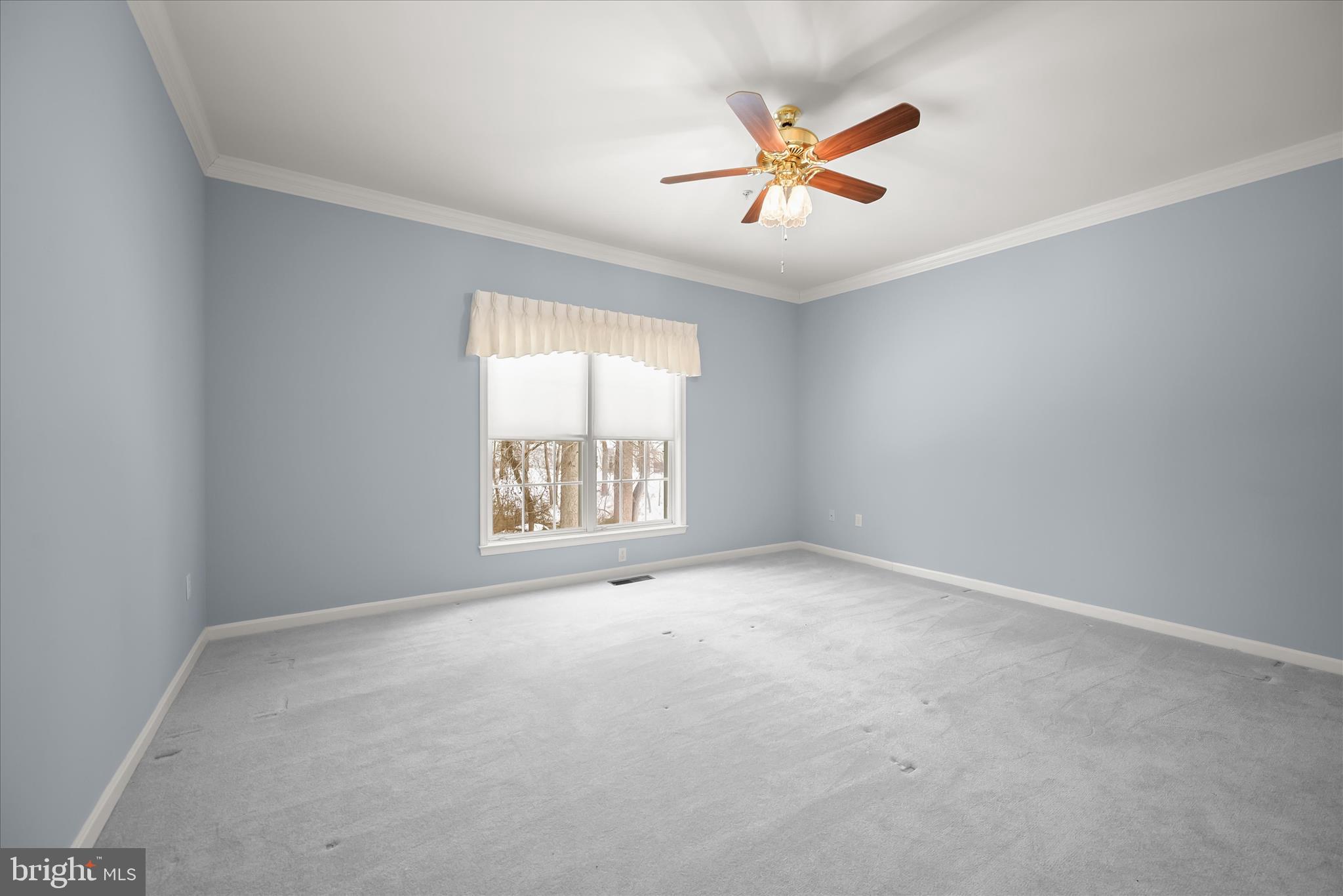 6428 Hickory Overlook, Unit 71 Columbia, MD 21044 - Photo 37 of 63 an empty room with windows and fan view