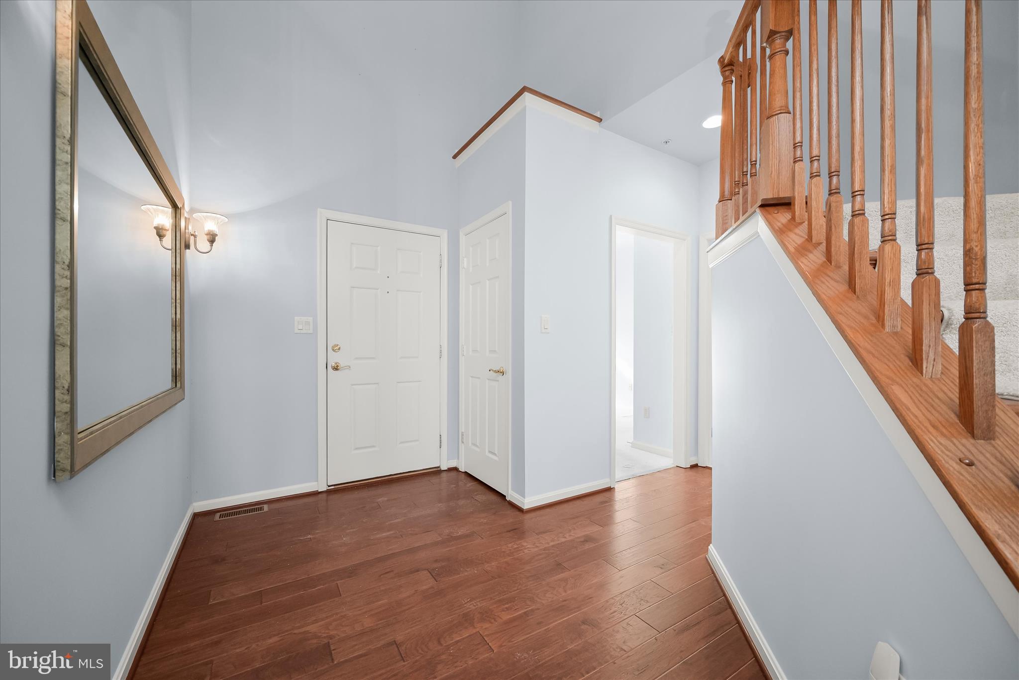 6428 Hickory Overlook, Unit 71 Columbia, MD 21044 - Photo 4 of 63 a view of a hallway with wooden floor and staircase
