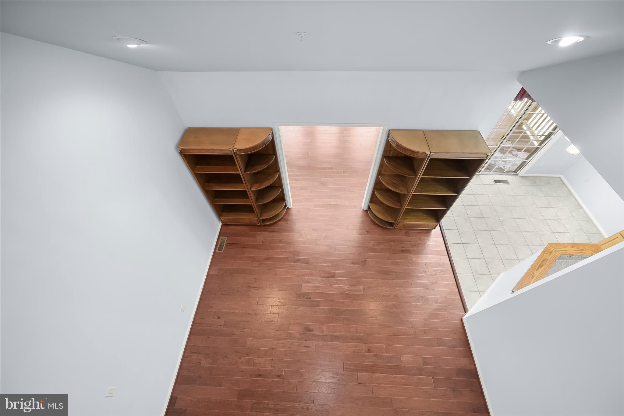 6428 Hickory Overlook, Unit 71 Columbia, MD 21044 - Photo 51 of 63 a room with wooden floor and furniture