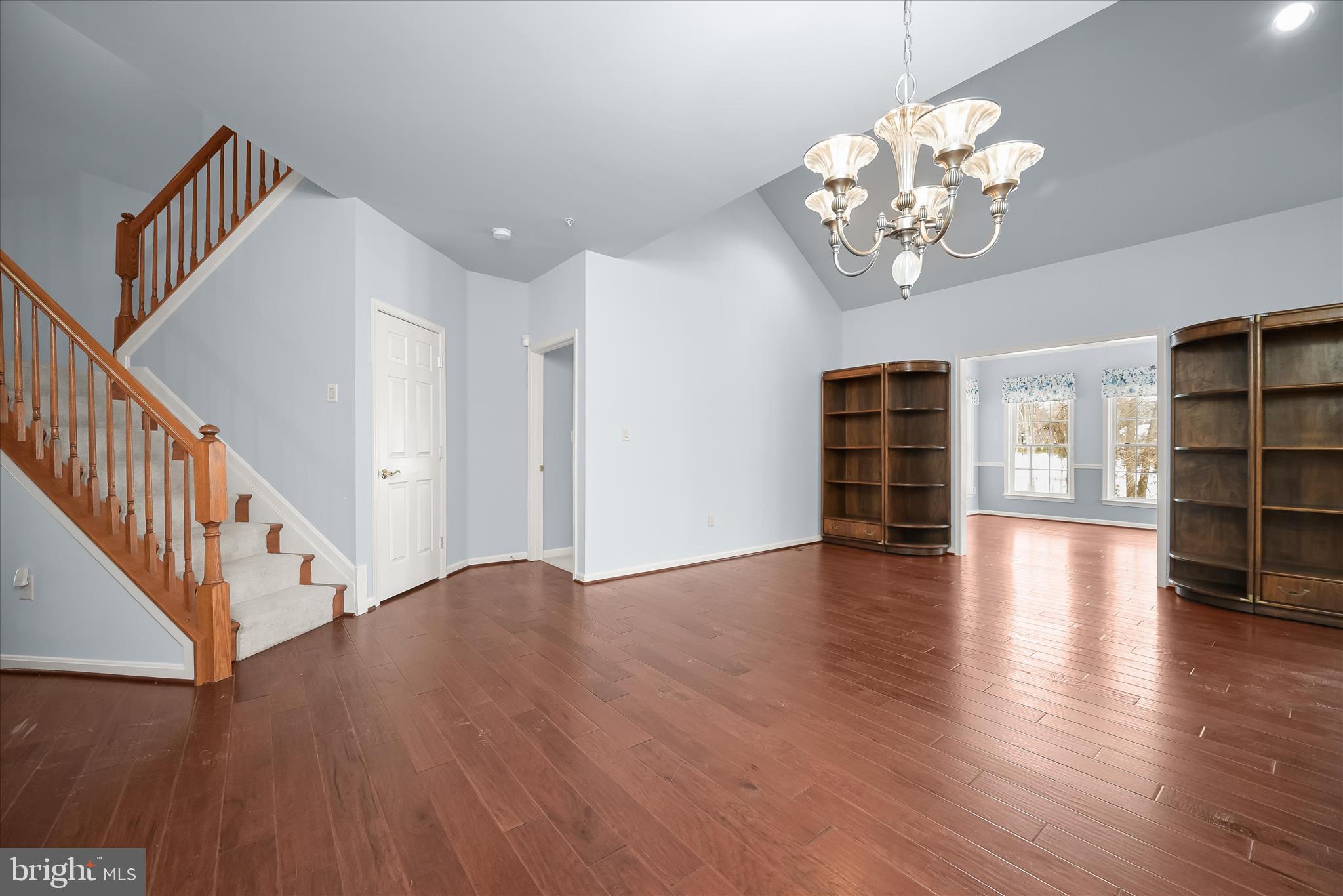 6428 Hickory Overlook, Unit 71 Columbia, MD 21044 - Photo 8 of 63 a view of an empty room with wooden floor and staircase