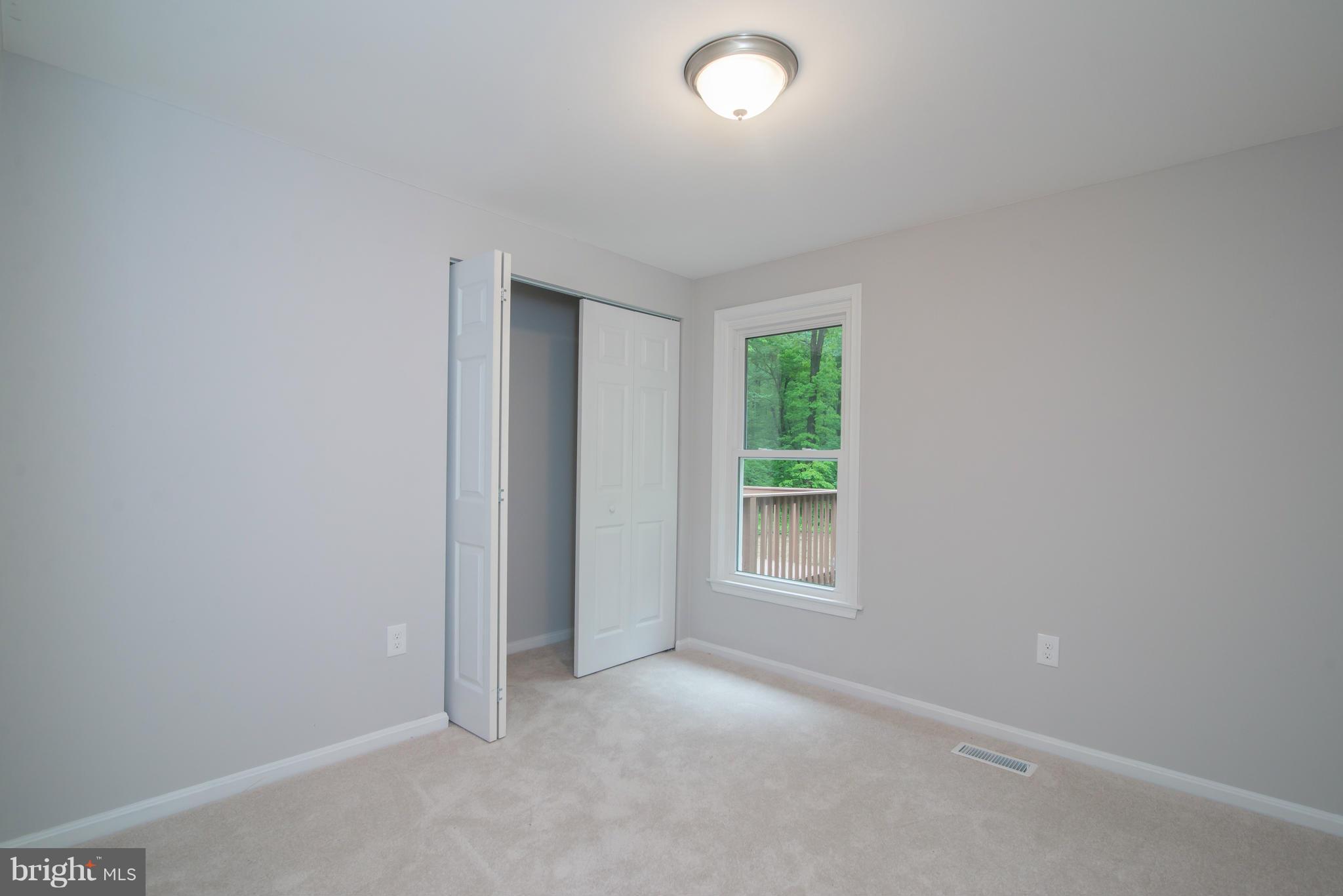 7132 Barry Road Alexandria, VA 22315 - Photo 14 of 28 an empty room with windows and closet