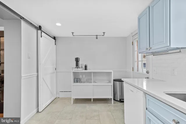 a kitchen with stainless steel appliances granite countertop a refrigerator stove and sink