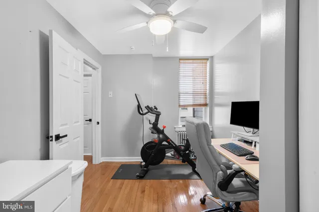 a bedroom with a workspace