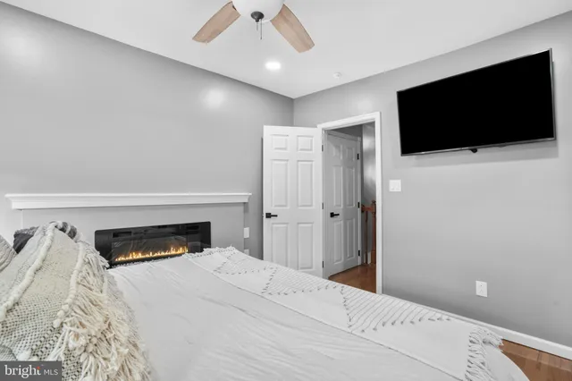 a large bedroom with a bed and furniture