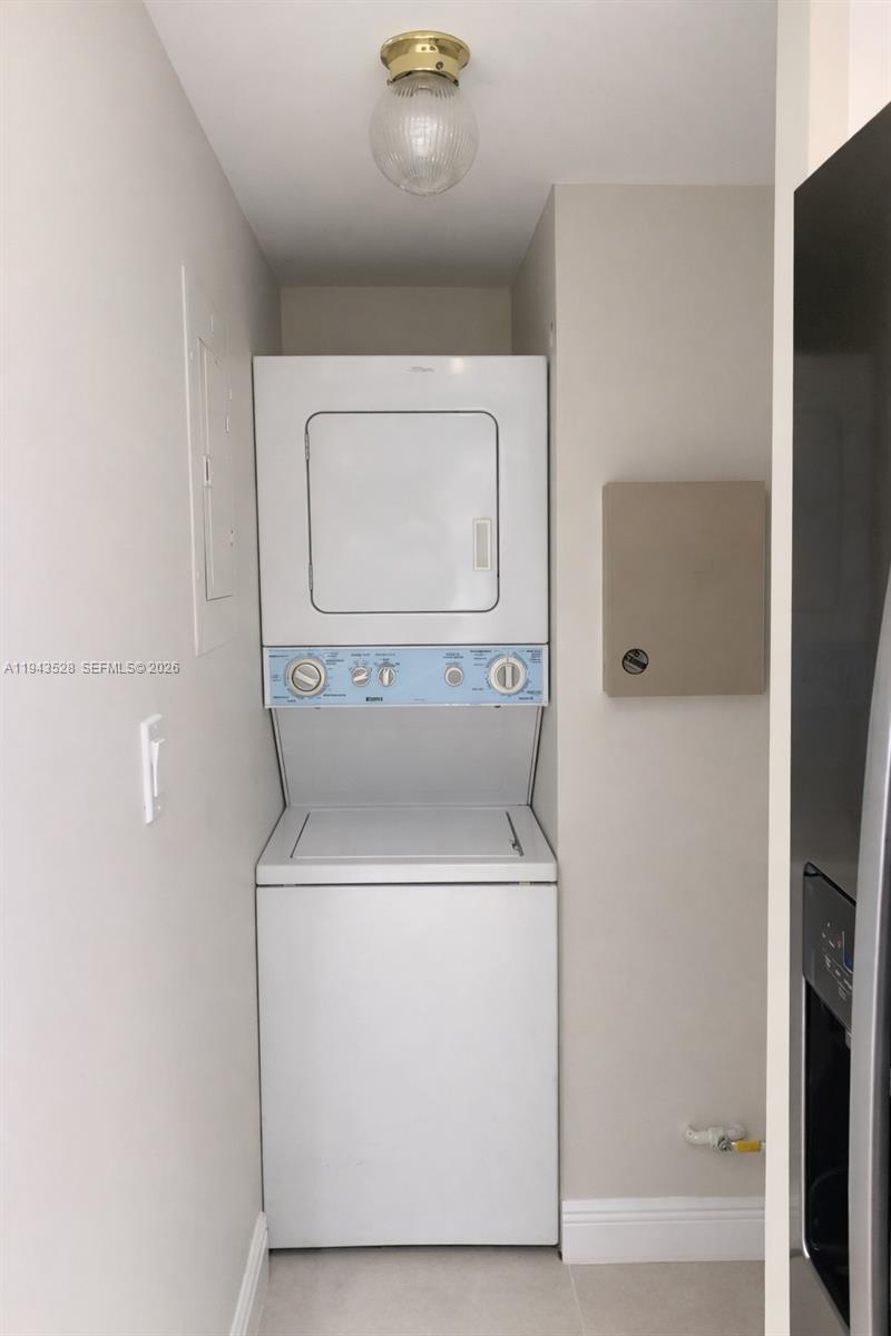 9033 Southwest 123rd Court, Unit 105 Miami, FL 33186 - Photo 8 of 11 a utility room with dryer and washer