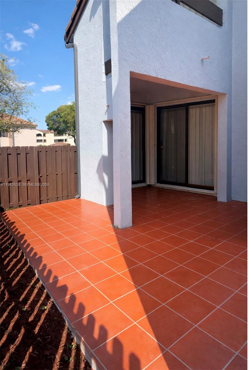 9033 Southwest 123rd Court, Unit 105 Miami, FL 33186 - Photo 10 of 11 a view of a backyard with basketball court