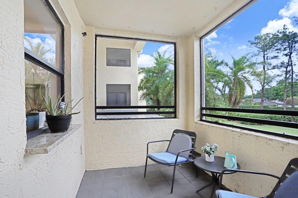 13602 South Village Drive, Unit 1205 Tampa, FL 33618 - Photo 20 of 51 a living room with furniture and a window