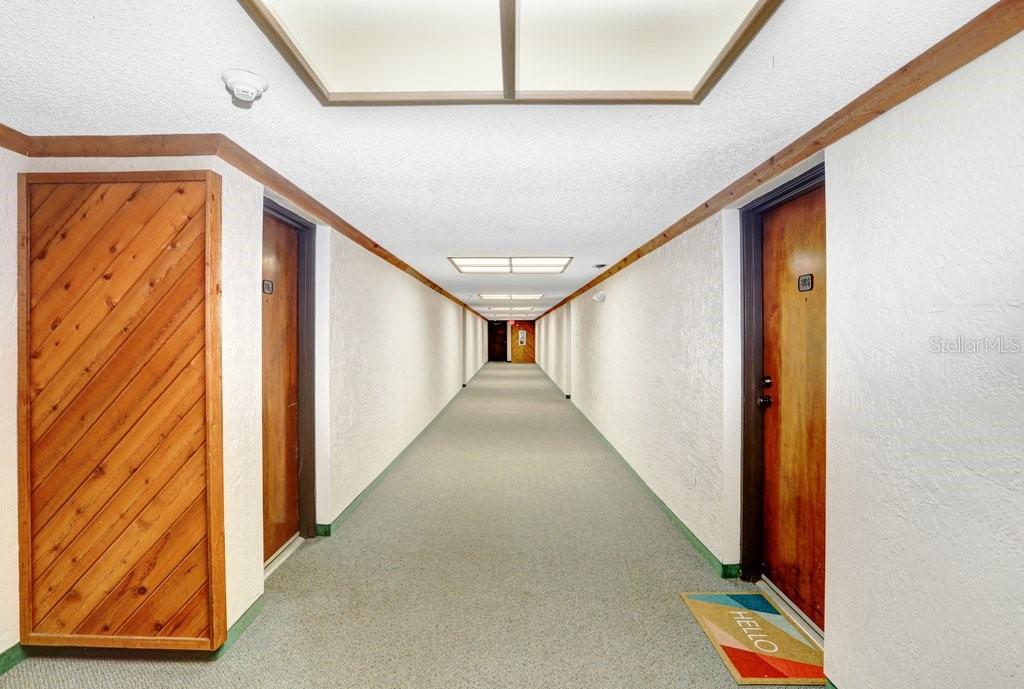 13602 South Village Drive, Unit 1205 Tampa, FL 33618 - Photo 24 of 51 a view of a hallway with stairs