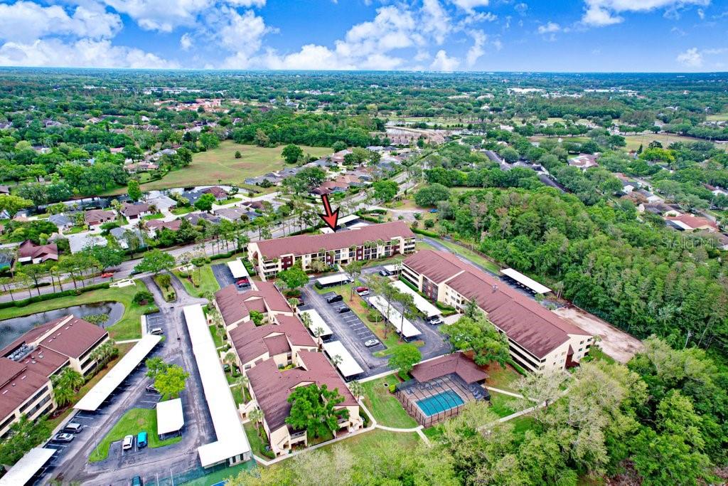 13602 South Village Drive, Unit 1205 Tampa, FL 33618 - Photo 25 of 51 an aerial view of residential building with outdoor space and pool
