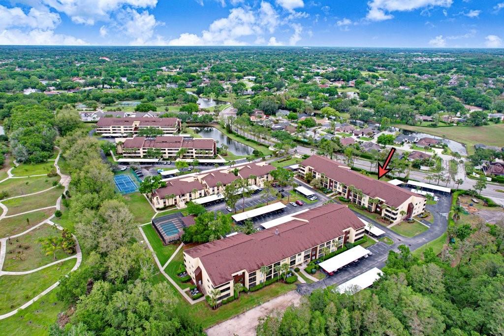 13602 South Village Drive, Unit 1205 Tampa, FL 33618 - Photo 26 of 51 an aerial view of residential houses with outdoor space and street view