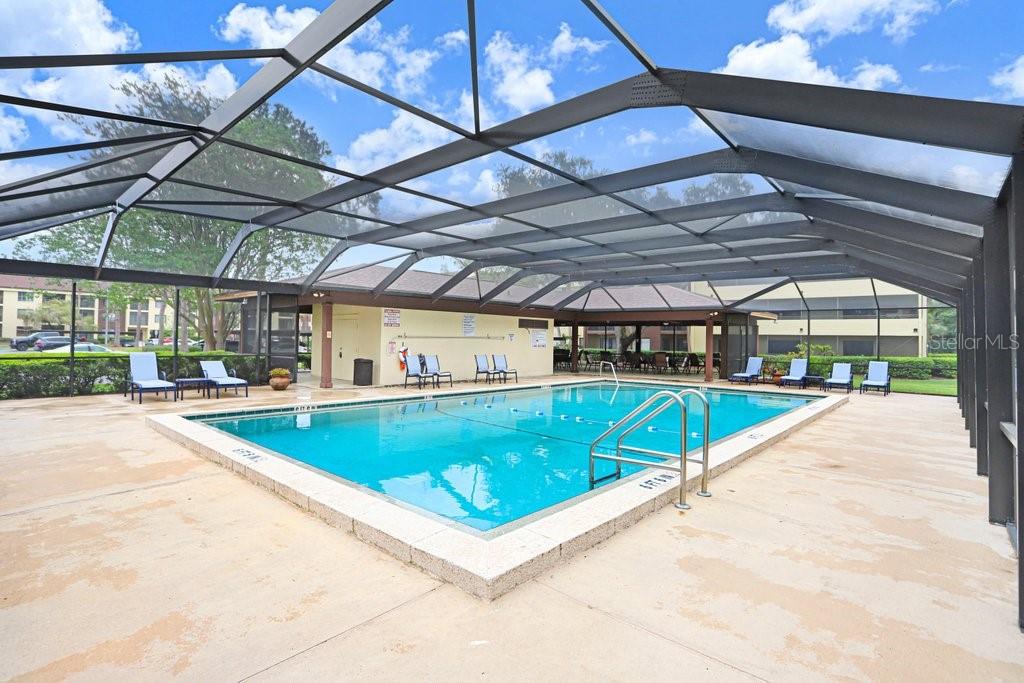 13602 South Village Drive, Unit 1205 Tampa, FL 33618 - Photo 30 of 51 a view of a swimming pool with a patio
