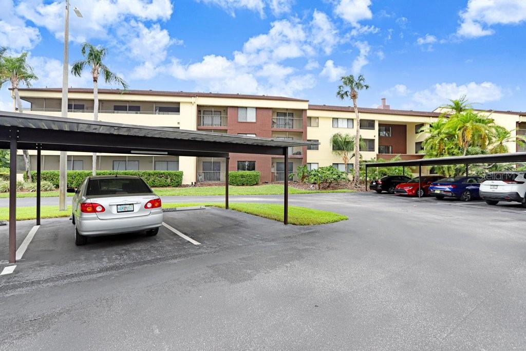 13602 South Village Drive, Unit 1205 Tampa, FL 33618 - Photo 32 of 51 a car parked in front of a building