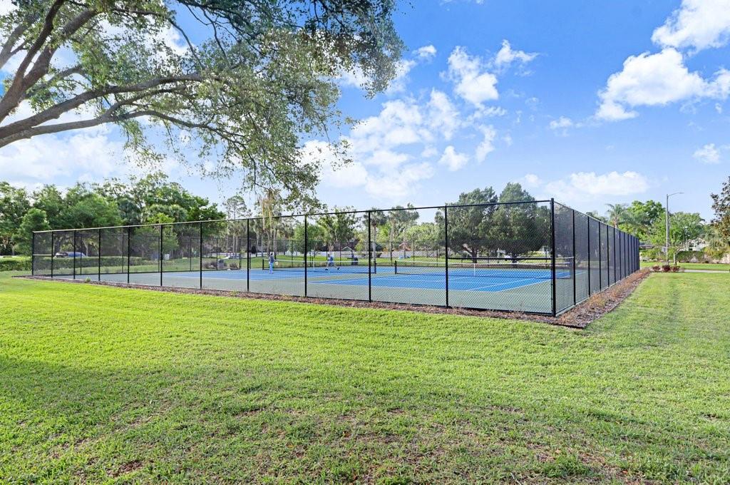 13602 South Village Drive, Unit 1205 Tampa, FL 33618 - Photo 47 of 51 a view of a bench in a park