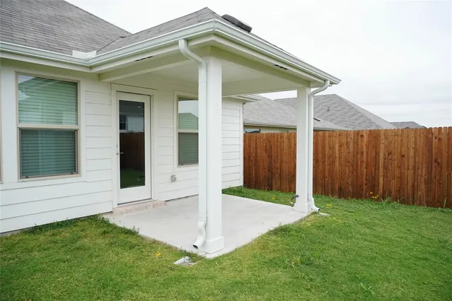 a view of front door and yard