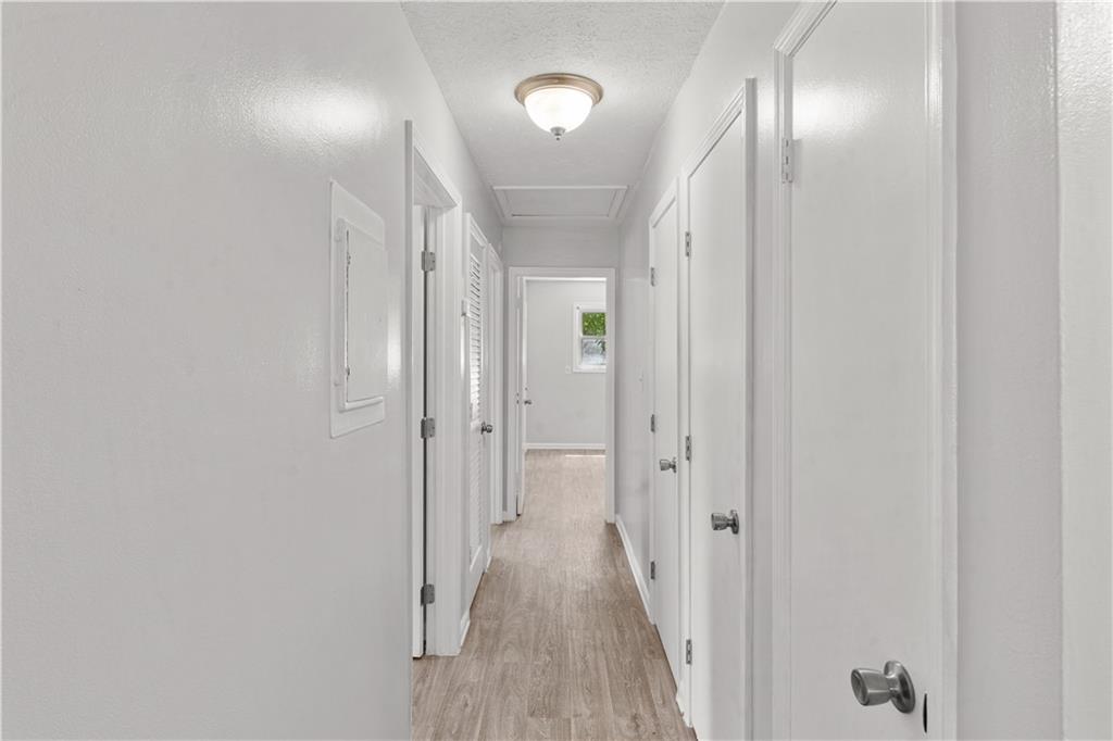 4776 Duncan Drive Powder Springs, GA 30127 - Photo 15 of 24 a view of a hallway with wooden floor