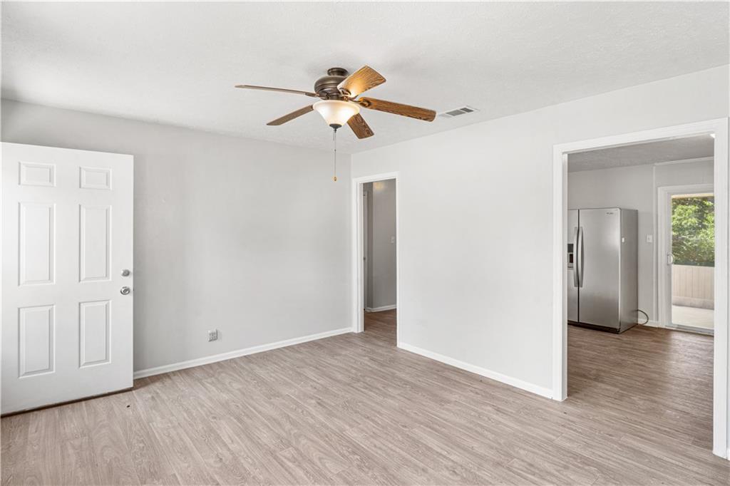 4776 Duncan Drive Powder Springs, GA 30127 - Photo 18 of 24 a view of empty room with wooden floor