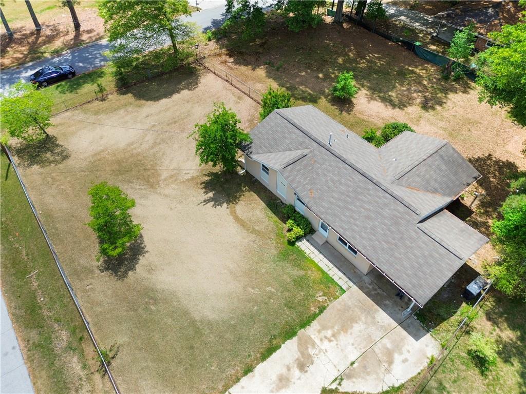 4776 Duncan Drive Powder Springs, GA 30127 - Photo 2 of 24 an aerial view of a house with a yard and a large pool