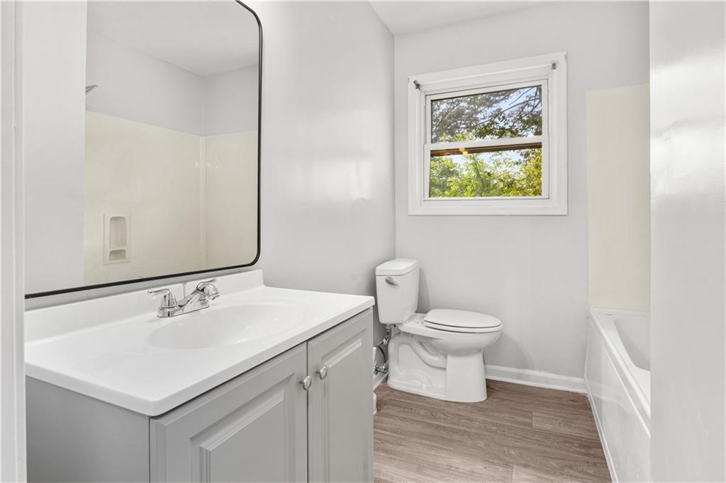 4776 Duncan Drive Powder Springs, GA 30127 - Photo 24 of 24 a bathroom with a sink toilet and a mirror