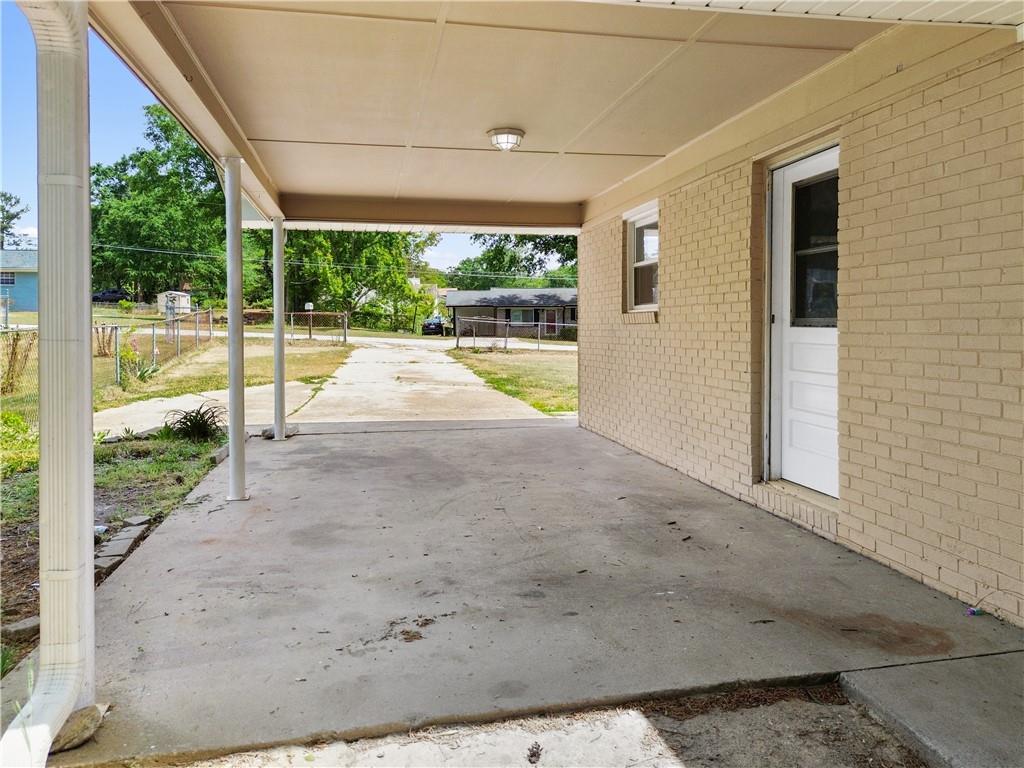 4776 Duncan Drive Powder Springs, GA 30127 - Photo 5 of 24 a view of a patio with table and chairs in front of a house