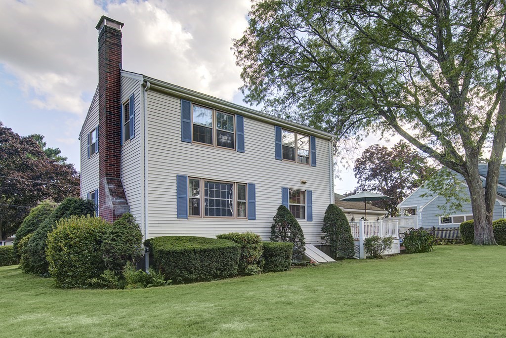 7 Rand Road Salem, MA 01970 - Photo 22 of 24 a front view of a house with a garden