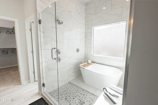 a spacious bathroom with a bathtub and toilet