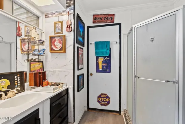 a view of a storage & utility room with a sink